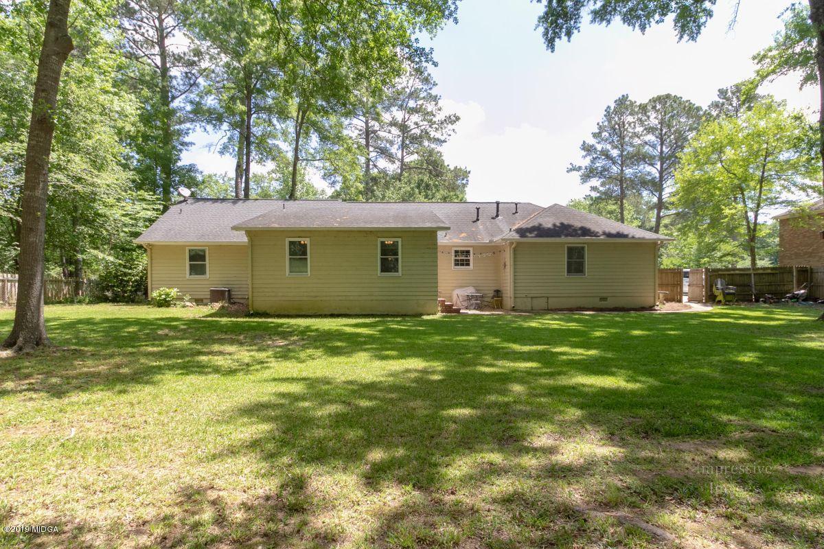 180 Castlegate Road Macon, GA 31210 - Photo 21 of 23 a view of a house with a backyard