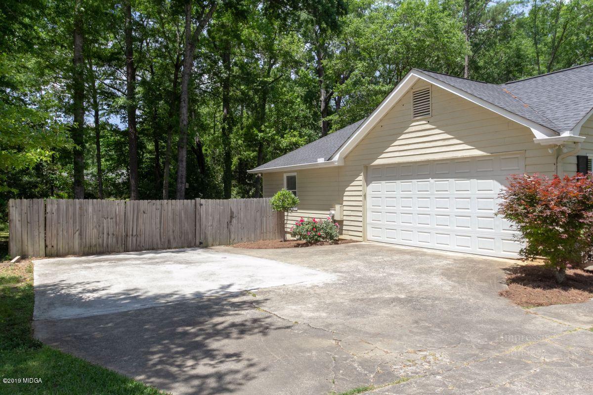180 Castlegate Road Macon, GA 31210 - Photo 23 of 23 a view of house with outdoor space and trees in the background