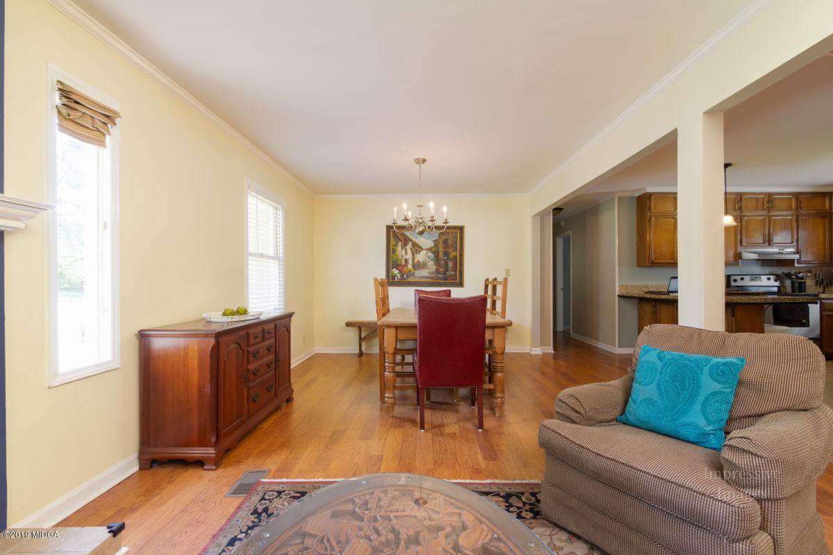 180 Castlegate Road Macon, GA 31210 - Photo 7 of 23 a living room with furniture window and wooden floor