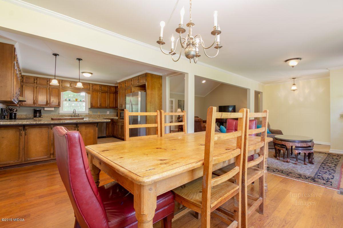 180 Castlegate Road Macon, GA 31210 - Photo 8 of 23 a view of a dining room with furniture and wooden floor