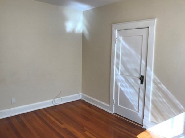 139 Pine Street, Unit 1/F Quincy, MA 02170 - Photo 8 of 10 wooden floor in an empty room