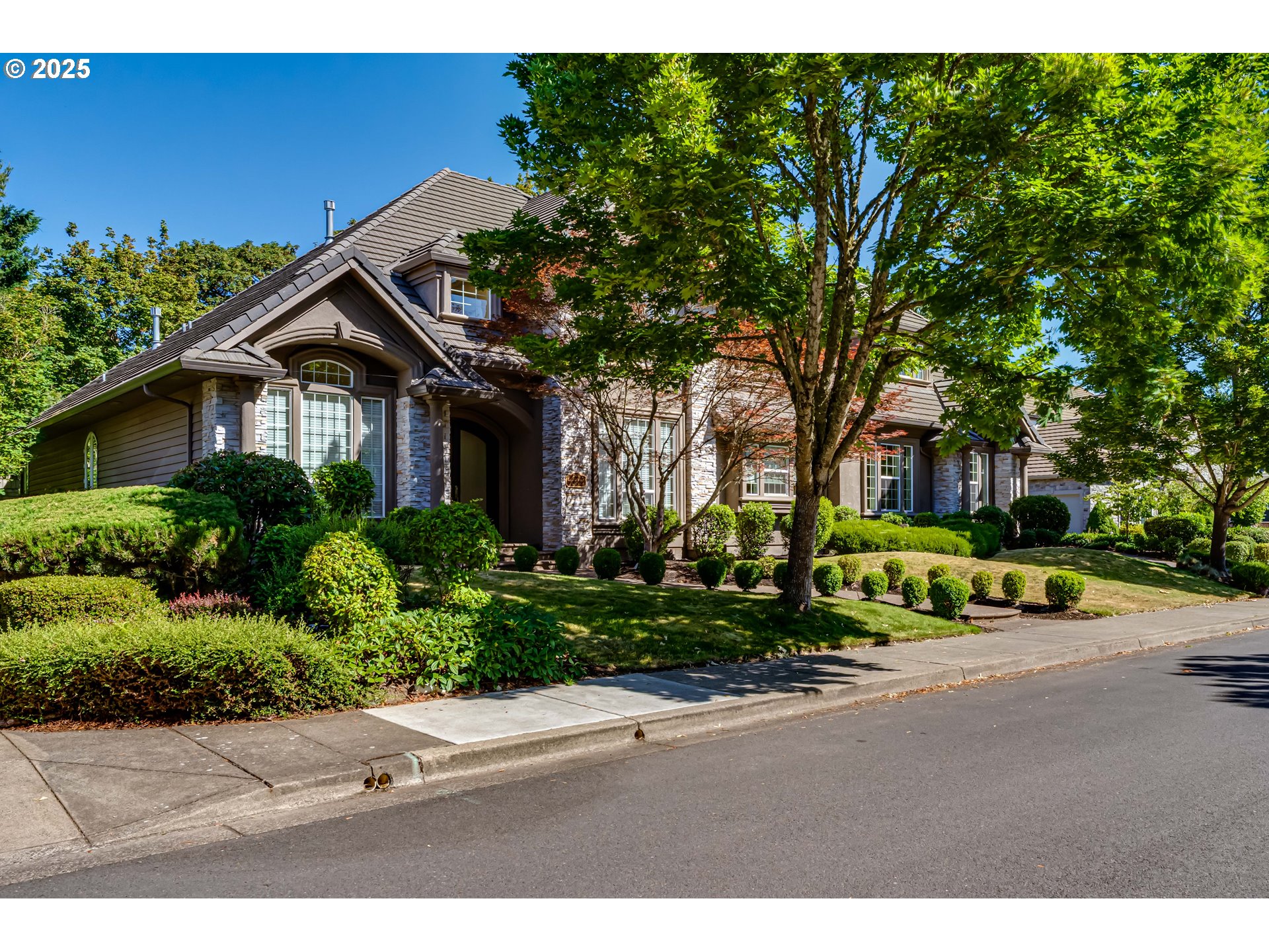 a front view of a house with a yard