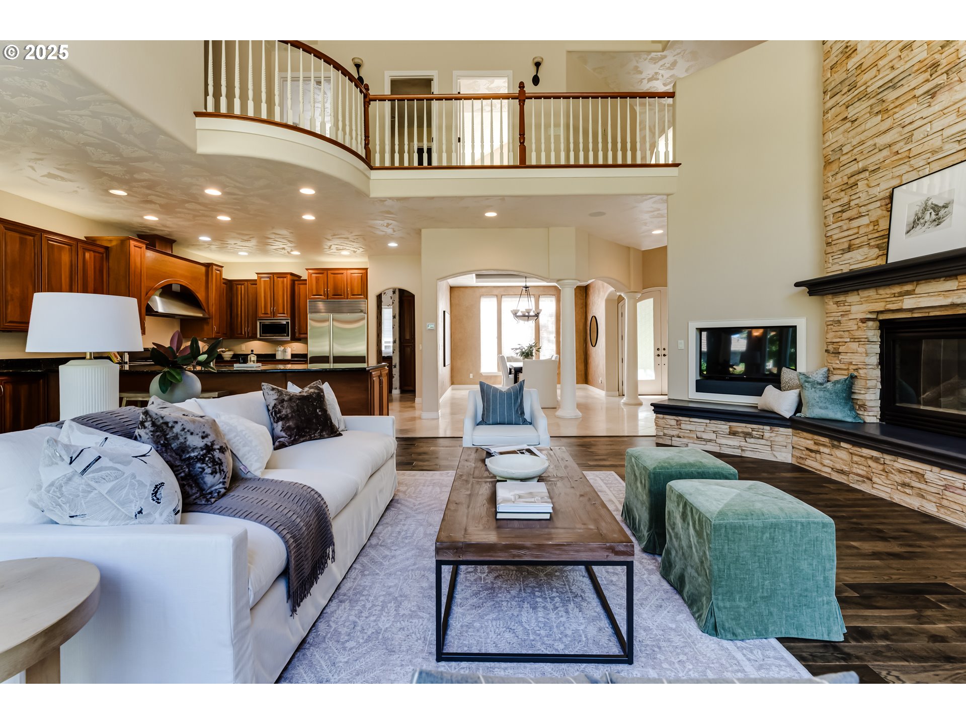 2874 Riverwalk Loop Eugene, OR 97401 - Photo 12 of 48 a living room with furniture a fireplace and a flat screen tv