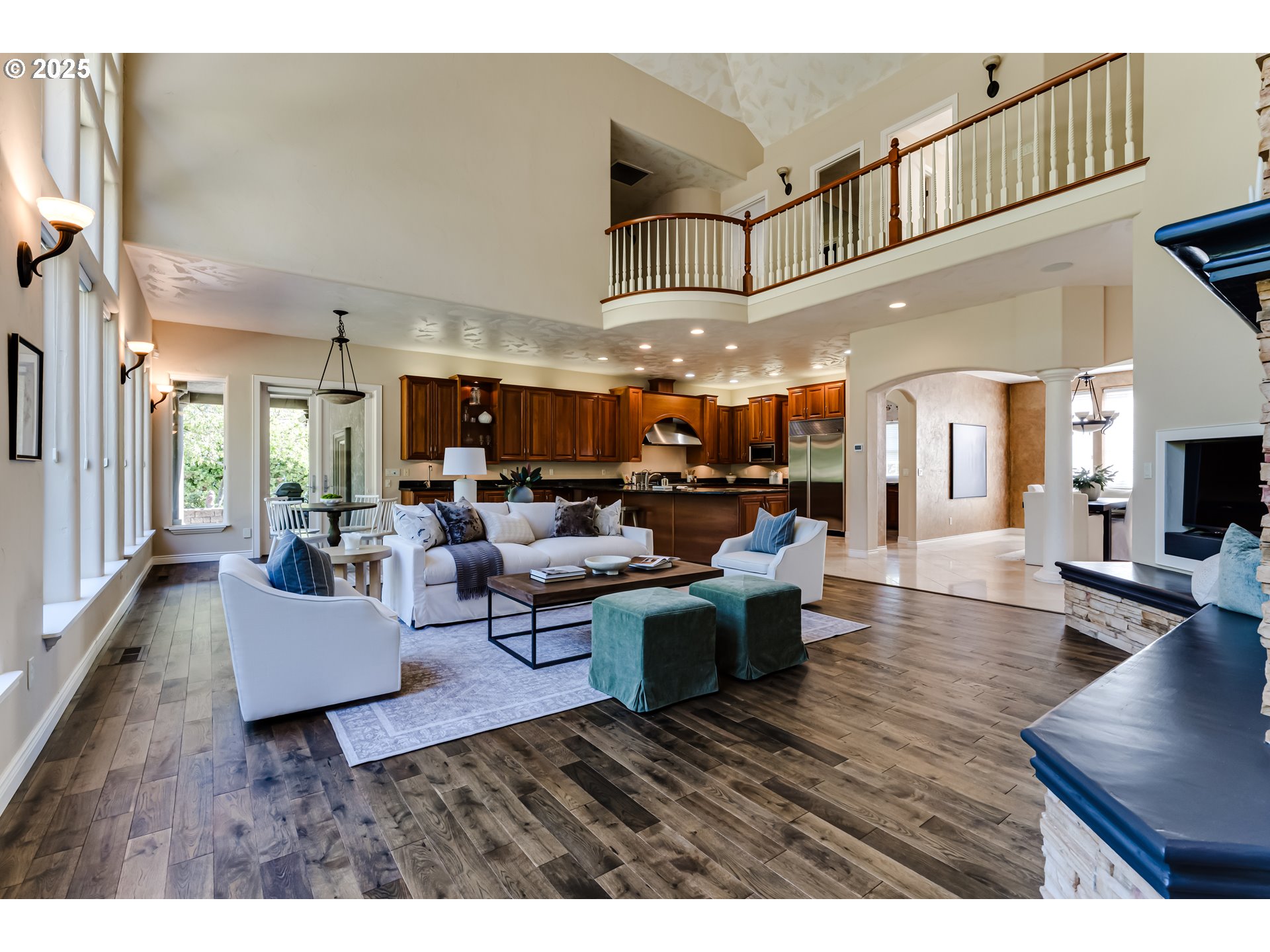 2874 Riverwalk Loop Eugene, OR 97401 - Photo 14 of 48 a living room with furniture kitchen view and a wooden floor