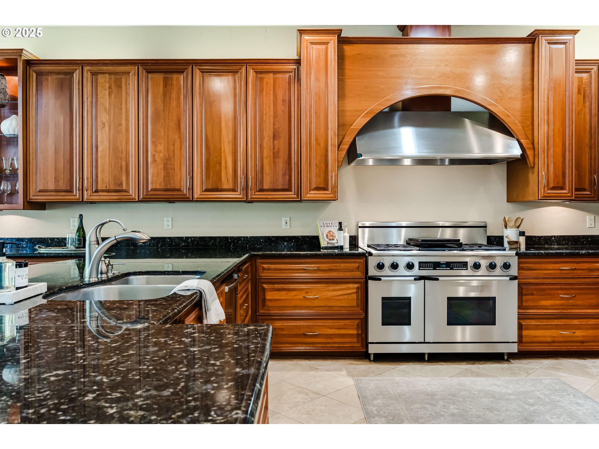2874 Riverwalk Loop Eugene, OR 97401 - Photo 19 of 48 a kitchen with granite countertop a stove and a sink