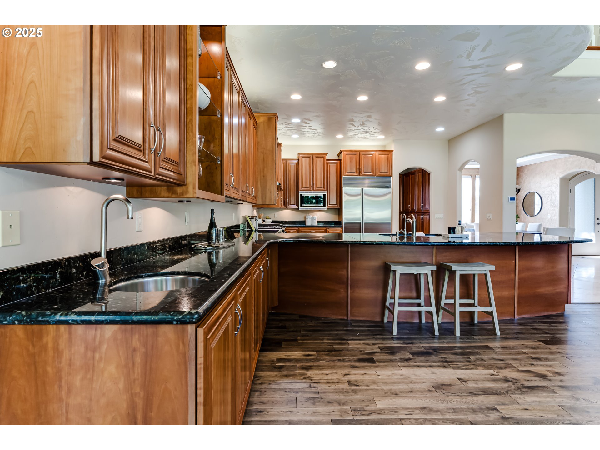 2874 Riverwalk Loop Eugene, OR 97401 - Photo 20 of 48 a kitchen view with granite countertop a sink and cabinets