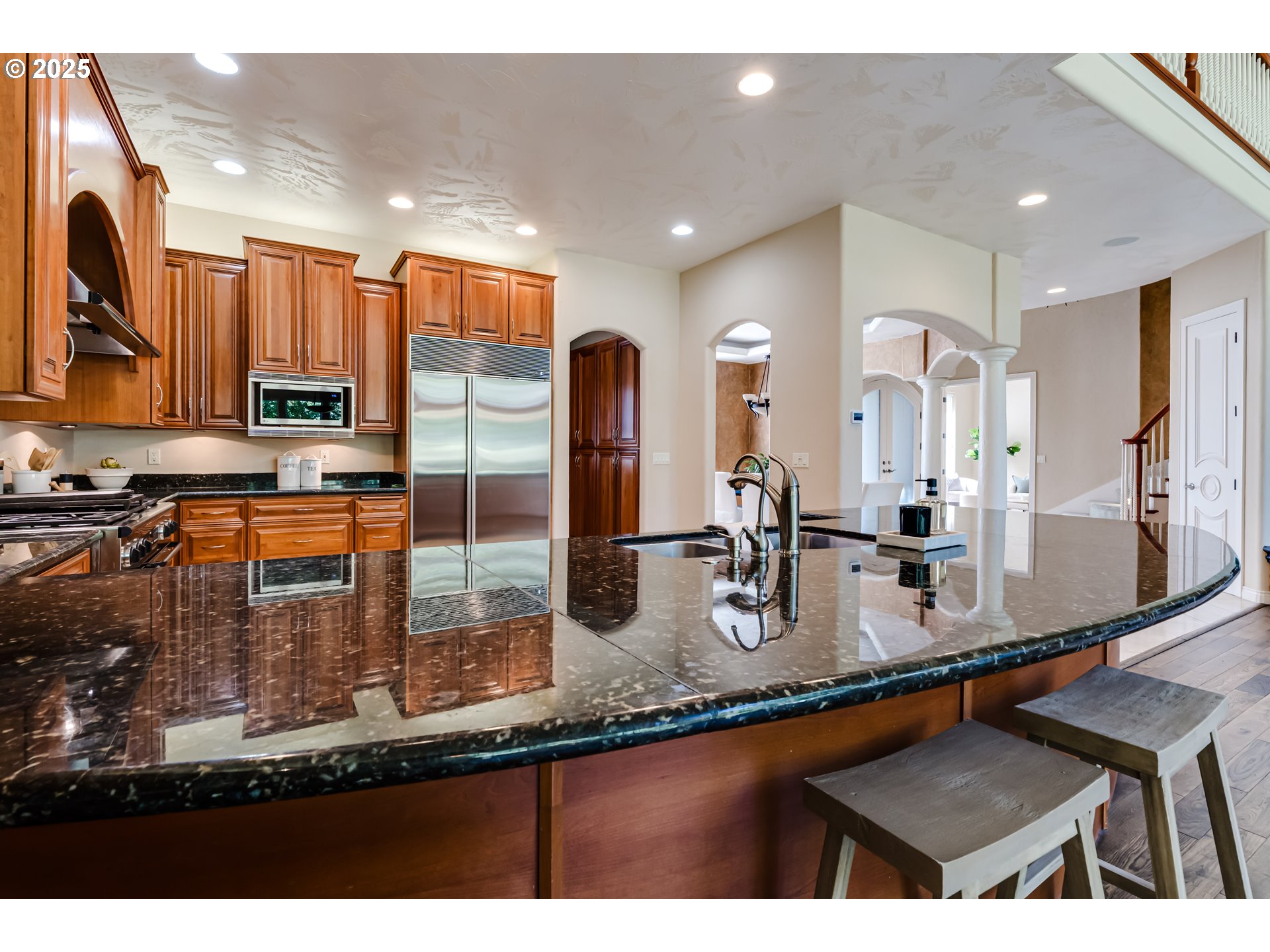 2874 Riverwalk Loop Eugene, OR 97401 - Photo 21 of 48 a kitchen with stainless steel appliances granite countertop a sink a stove and a refrigerator
