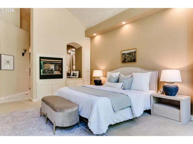 a bedroom with a bed and a couch