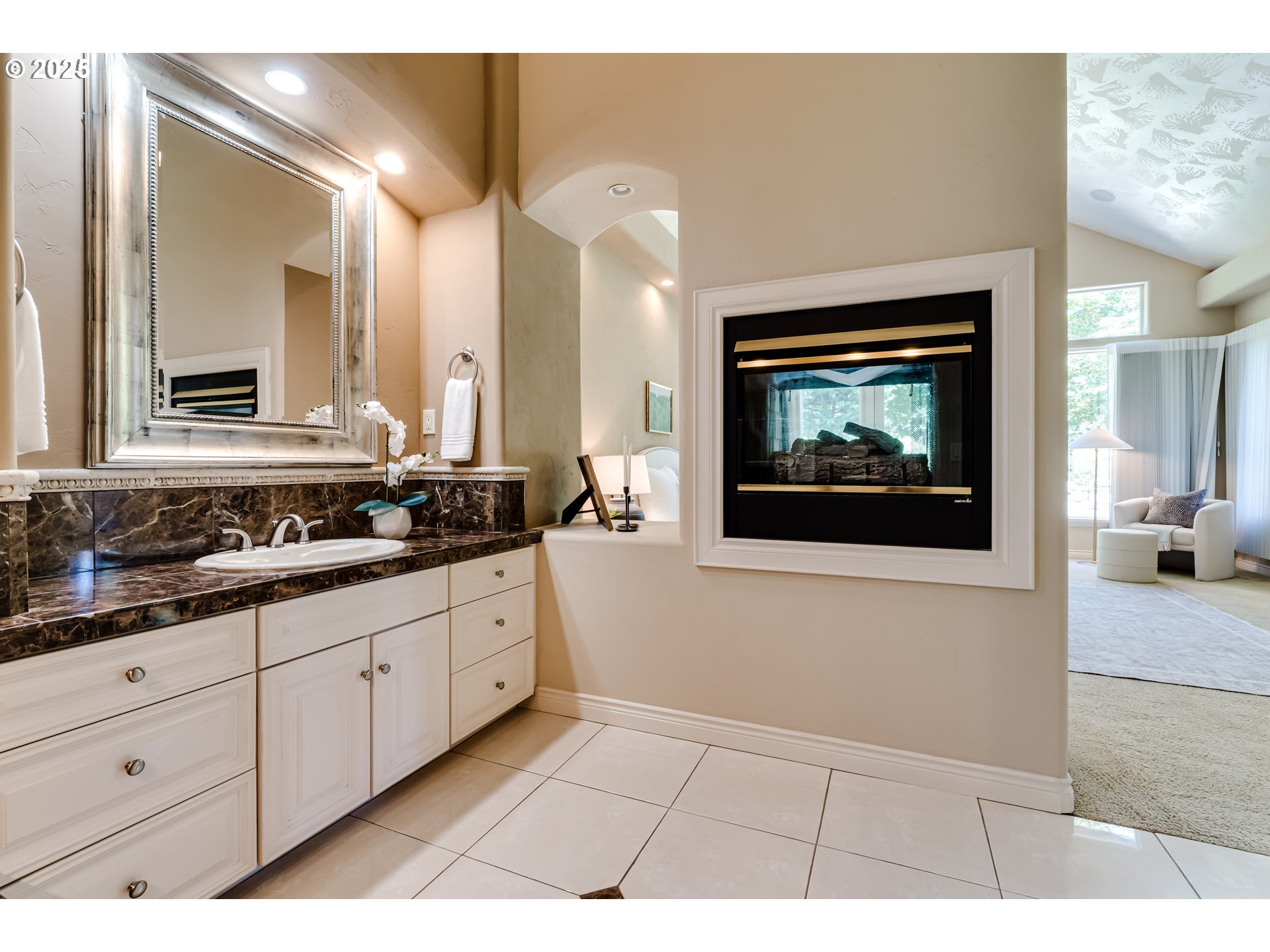 2874 Riverwalk Loop Eugene, OR 97401 - Photo 28 of 48 a bathroom with a sink a mirror and a view of living room