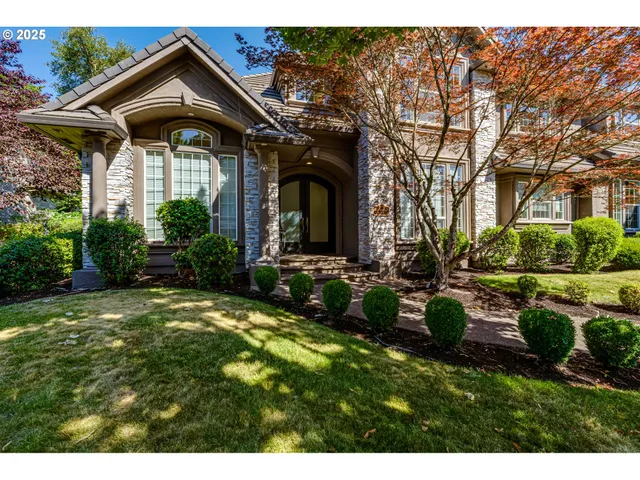 a front view of a house with garden