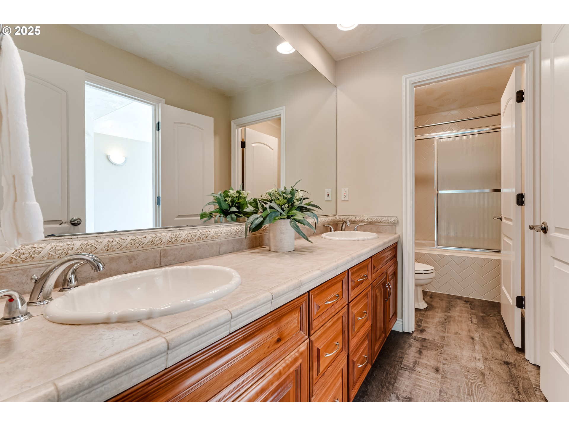 2874 Riverwalk Loop Eugene, OR 97401 - Photo 34 of 48 a bathroom with a granite countertop sink and a bathtub