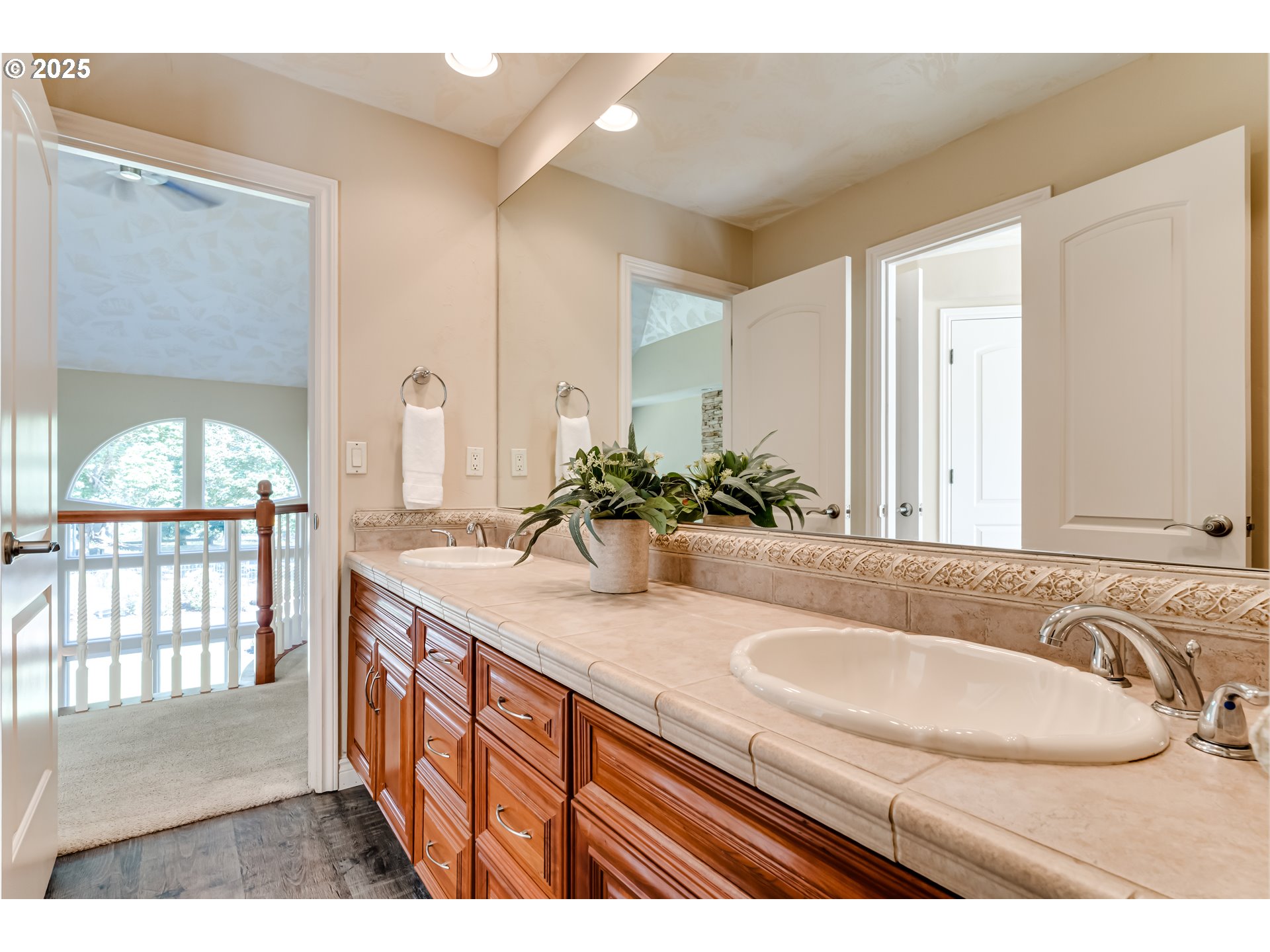 2874 Riverwalk Loop Eugene, OR 97401 - Photo 35 of 48 a bathroom with a granite countertop sink a mirror and a shower