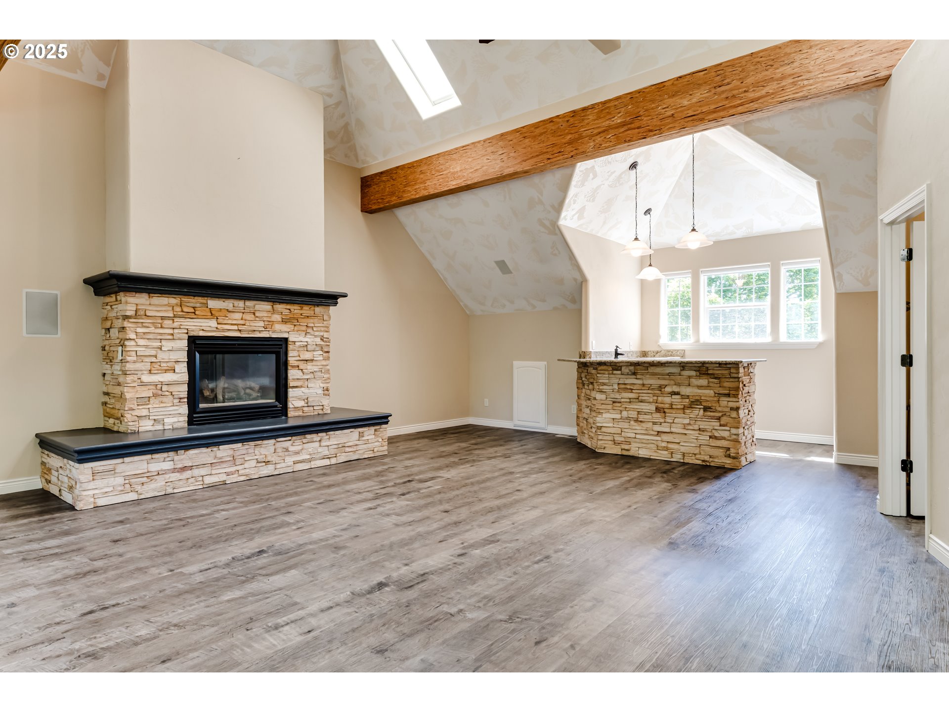 2874 Riverwalk Loop Eugene, OR 97401 - Photo 39 of 48 a view of an empty room with wooden floor fireplace and a window