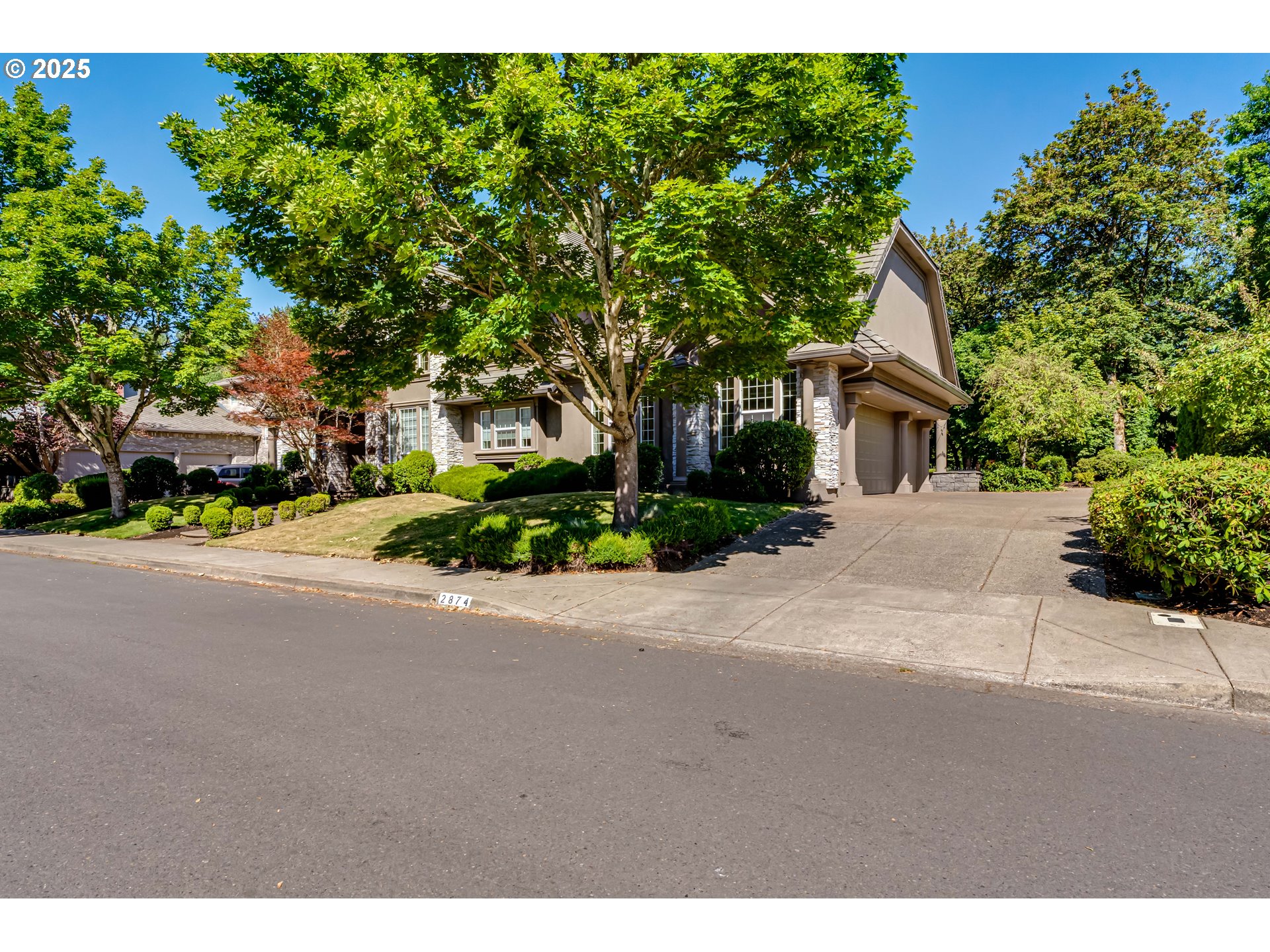 2874 Riverwalk Loop Eugene, OR 97401 - Photo 41 of 48 a front view of a house with a yard and a garage