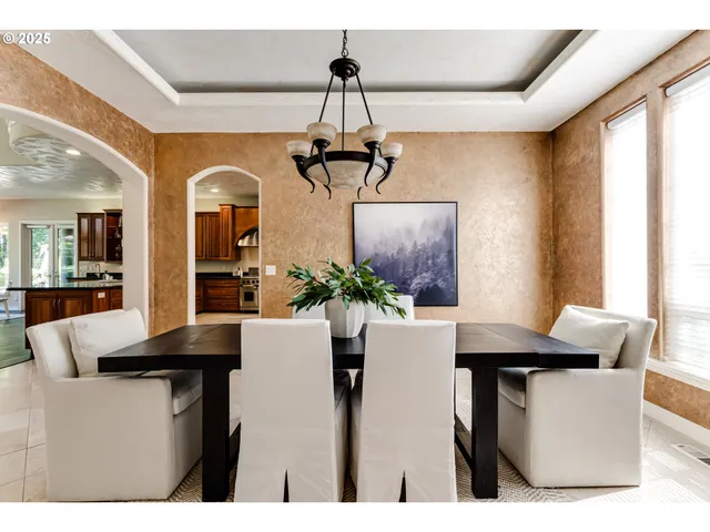 a dining room with table and chairs