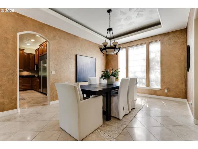 a view of a dining room with furniture window and chandelier