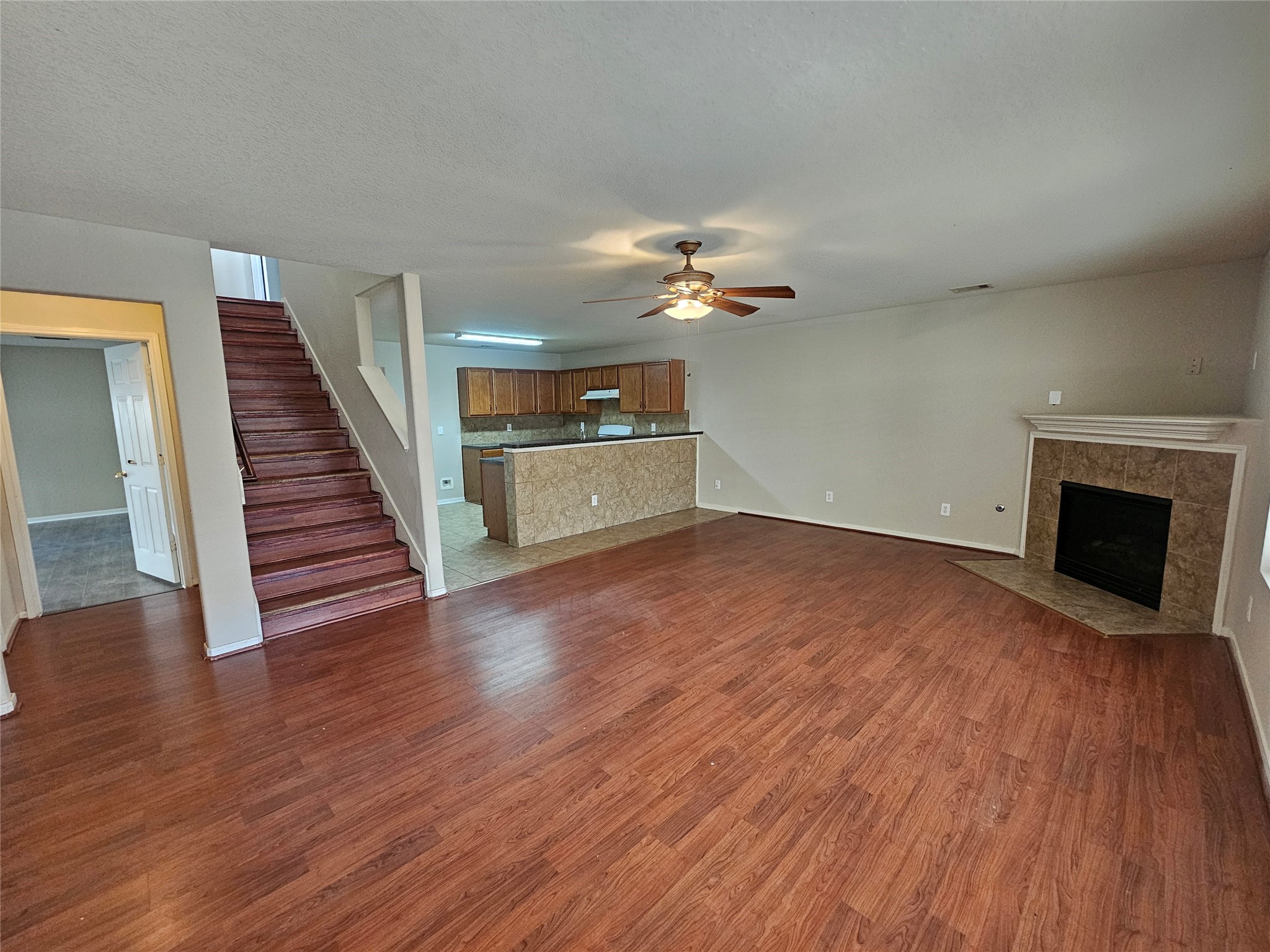 11015 Walkup Way Houston, TX 77044 - Photo 9 of 26 Living open to the kitchen and looking towards the half bath and master