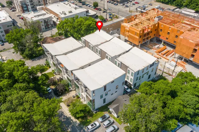 an aerial view of residential house with an outdoor space
