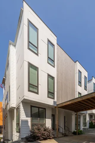 a front view of a building with parking space