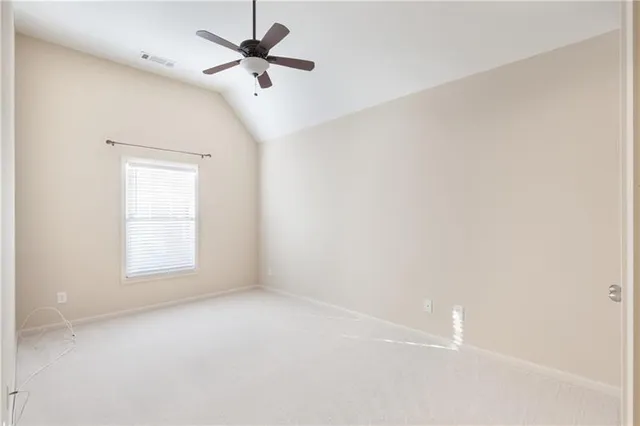 a spacious bathroom with a shower sink and mirror