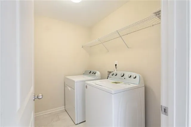 a view of a livingroom with a ceiling fan and window