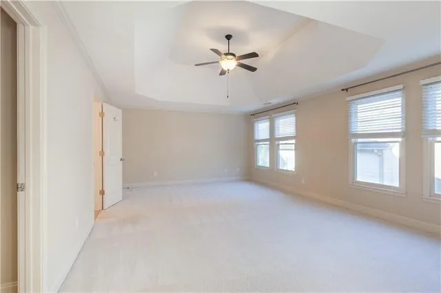 a spacious bathroom with a double vanity sink a mirror and a bathtub