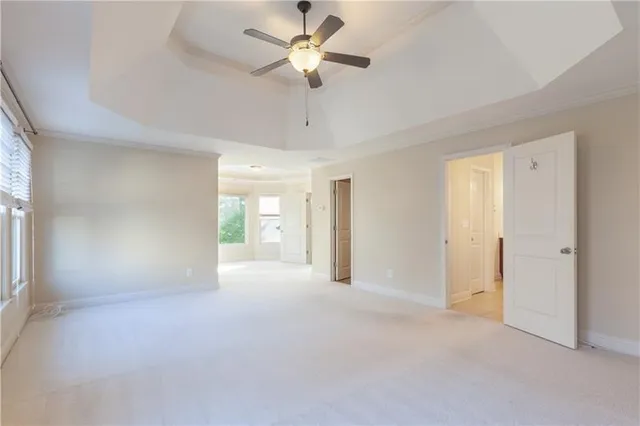 a bathroom with a tub a sink and a large mirror