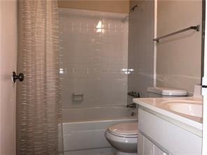 394 Promenade Court Marietta, GA 30064 - Photo 14 of 14 a bathroom with a granite countertop bathtub shower sink vanity and toilet