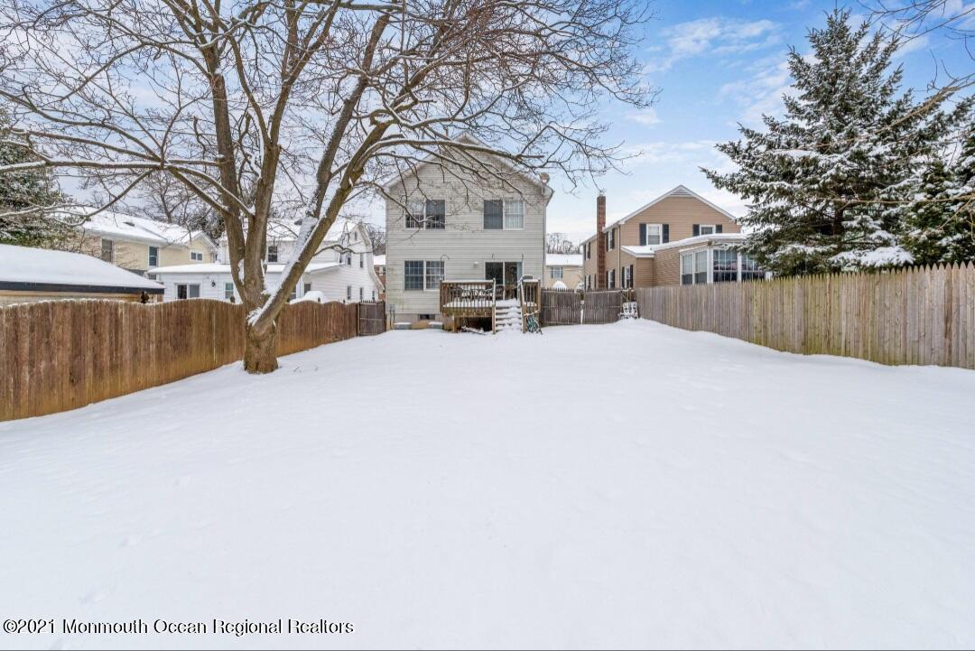 298 Spring Street Red Bank, NJ 07701 - Photo 1 of 17 a view of a white house covered with snow