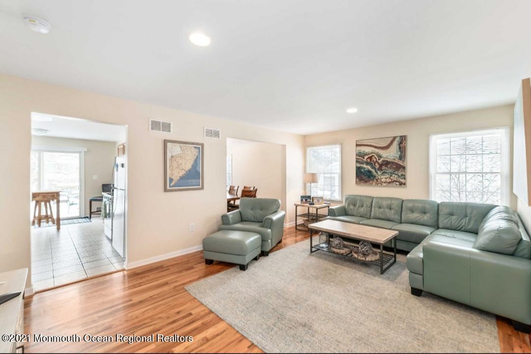 298 Spring Street Red Bank, NJ 07701 - Photo 11 of 17 a living room with furniture and a window