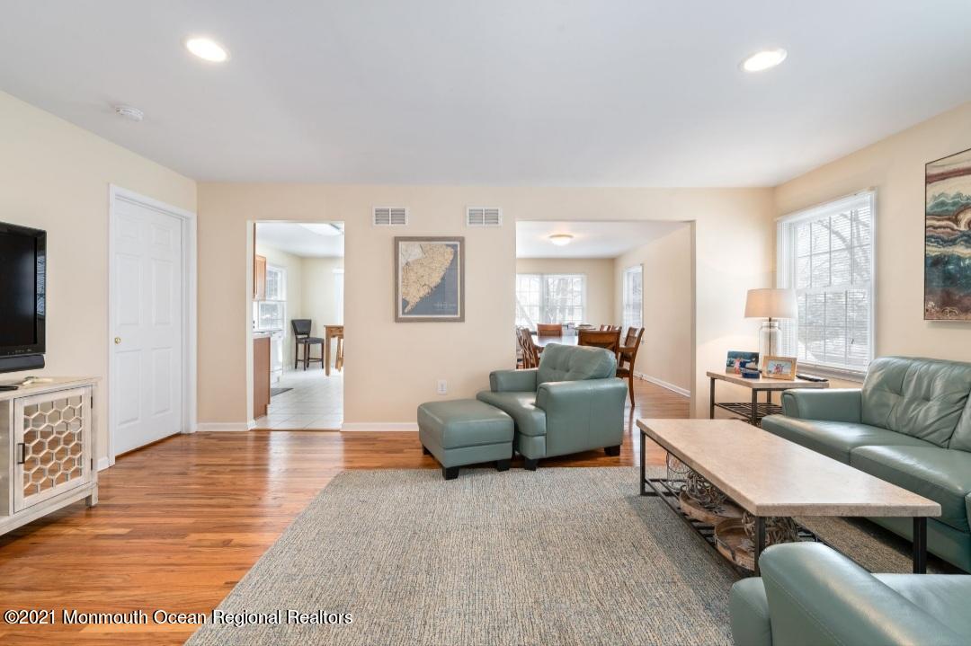 298 Spring Street Red Bank, NJ 07701 - Photo 12 of 17 a living room with furniture and a flat screen tv