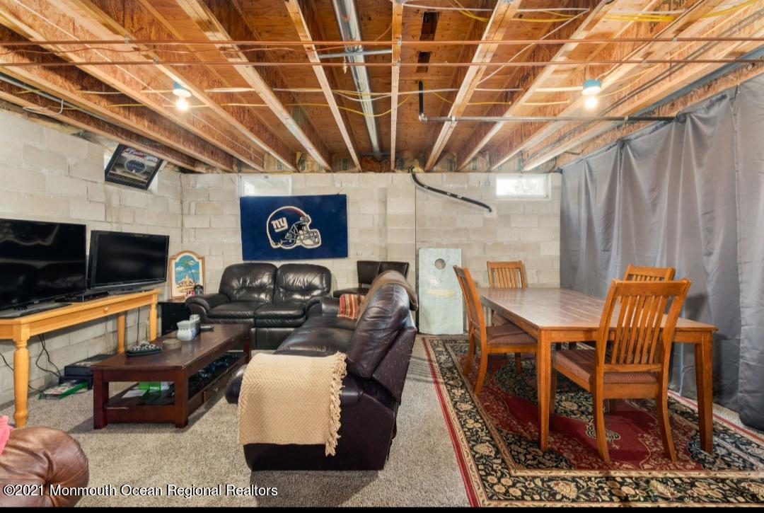 298 Spring Street Red Bank, NJ 07701 - Photo 15 of 17 a living room with furniture and a flat screen tv