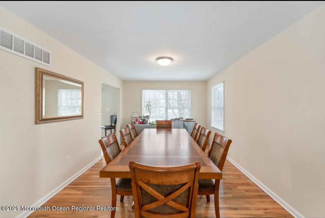 298 Spring Street Red Bank, NJ 07701 - Photo 6 of 17 a view of a dining room with furniture and wooden floor