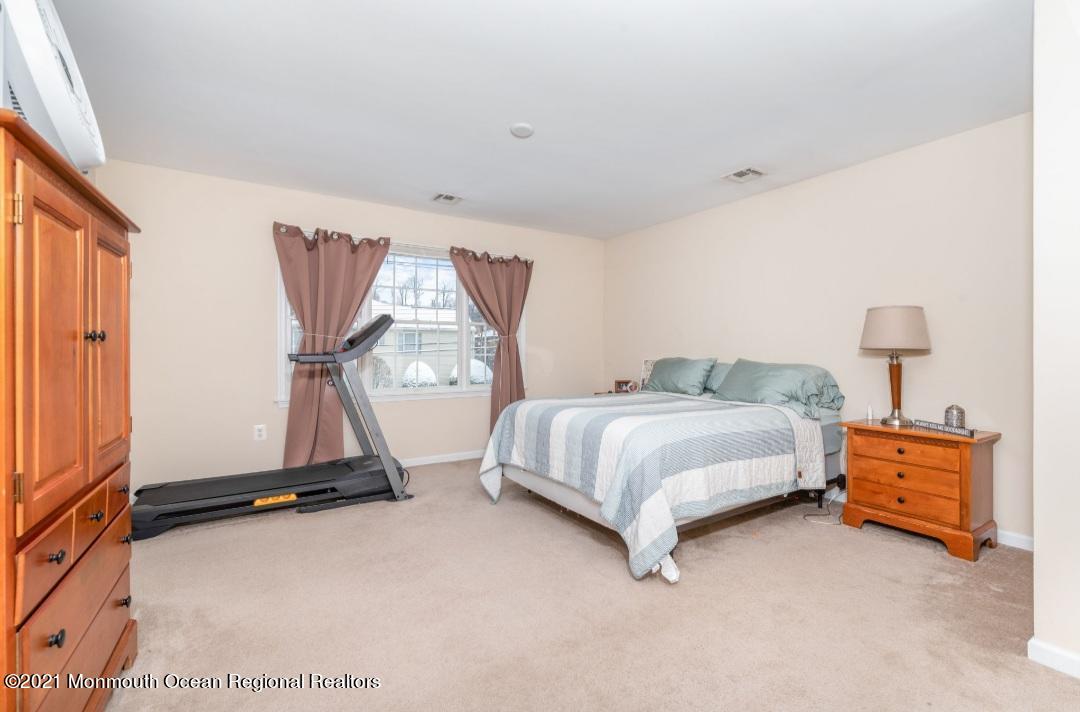 298 Spring Street Red Bank, NJ 07701 - Photo 10 of 17 a bedroom with a bed and a window