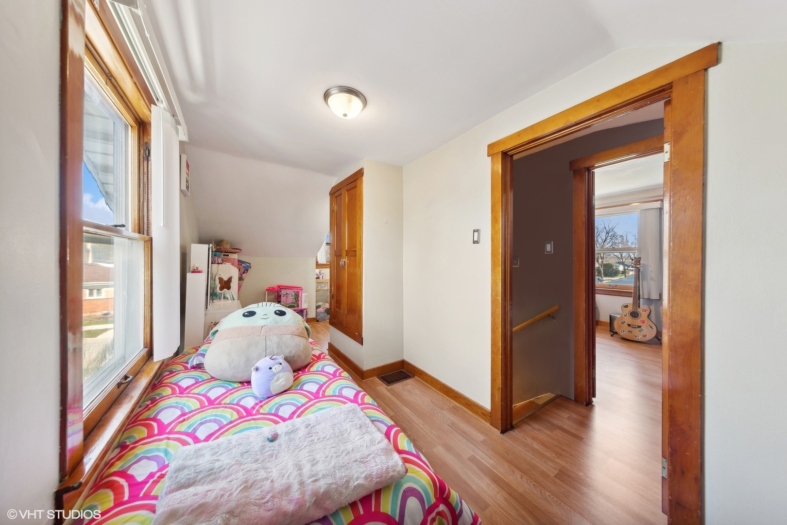 8715 44th Place Lyons, IL 60534 - Photo 13 of 28 a bedroom with a bed and wooden floor