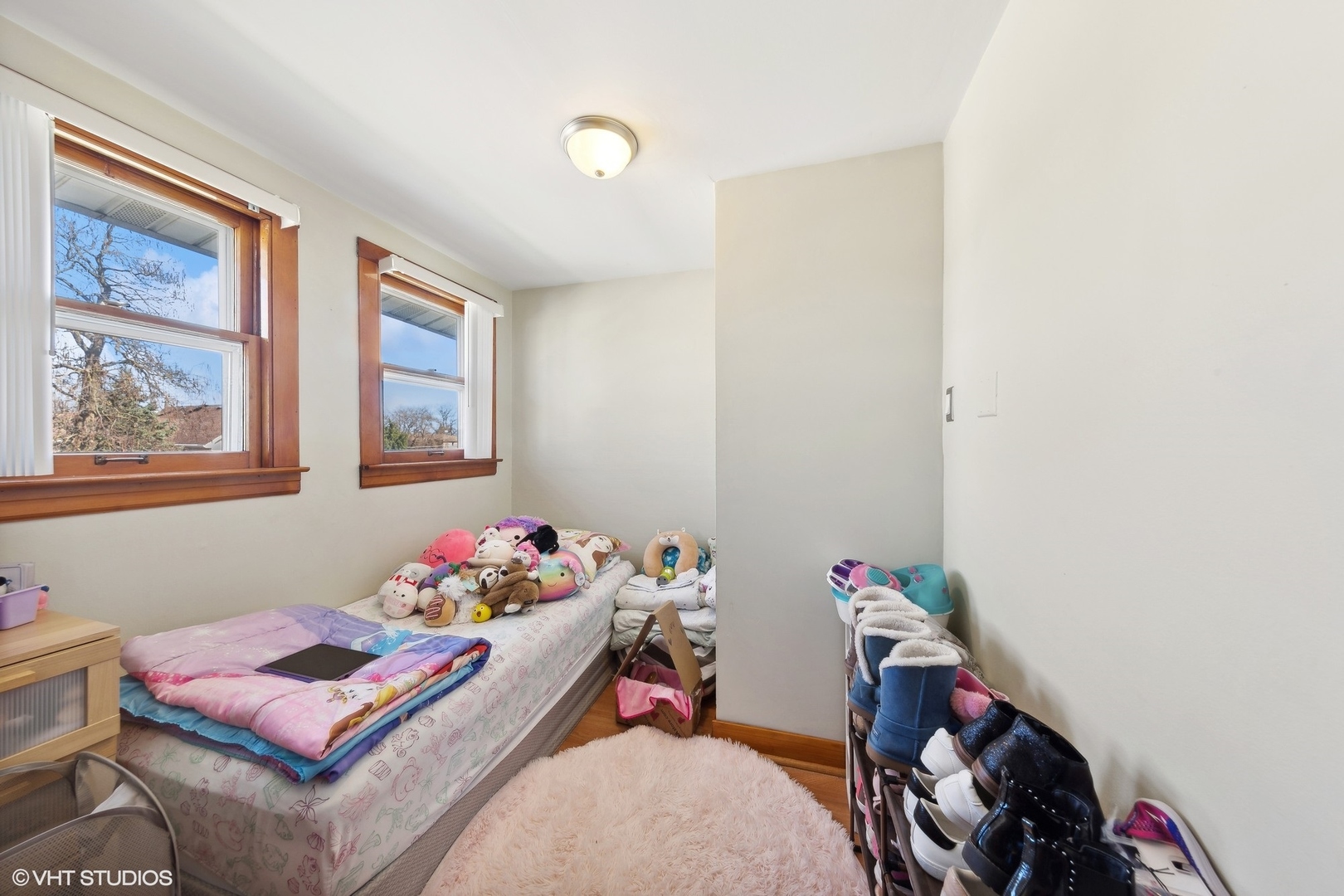 8715 44th Place Lyons, IL 60534 - Photo 14 of 28 a bedroom with furniture and a window