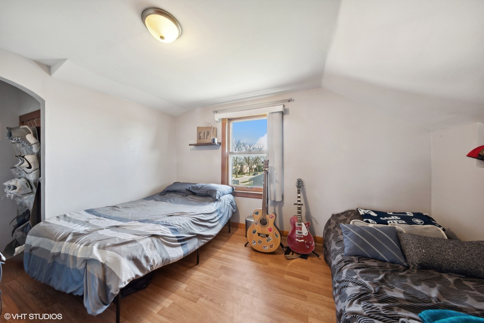 8715 44th Place Lyons, IL 60534 - Photo 15 of 28 a bedroom with a bed and a window