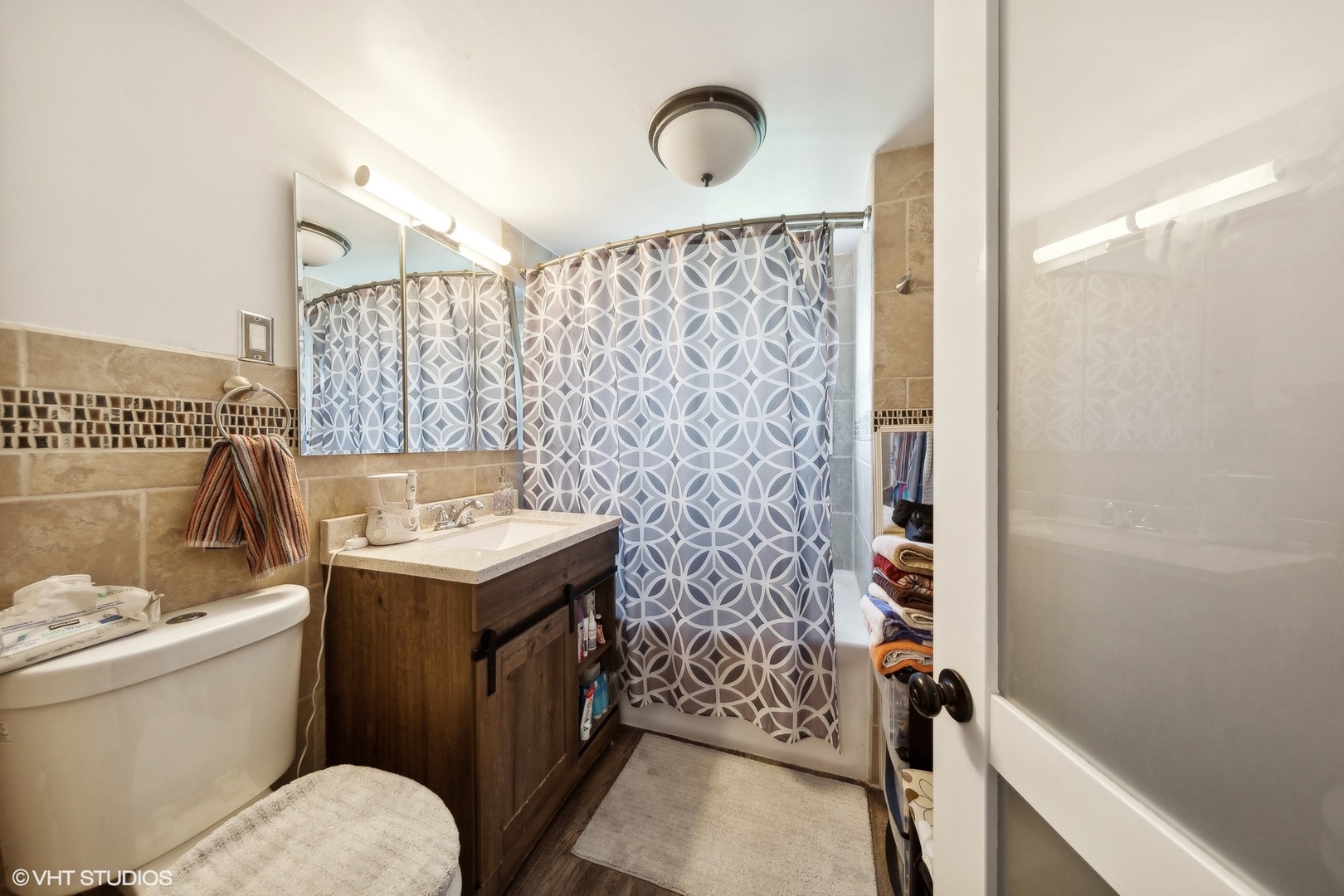 8715 44th Place Lyons, IL 60534 - Photo 16 of 28 a bathroom with a sink toilet and shower
