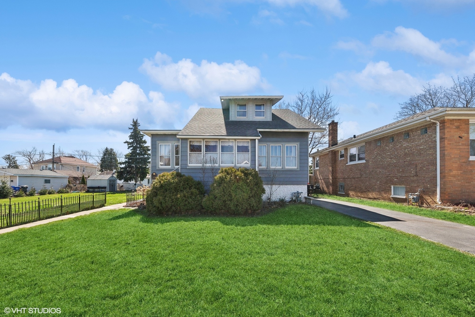 8715 44th Place Lyons, IL 60534 - Photo 2 of 28 a view of a house with a big yard and large trees