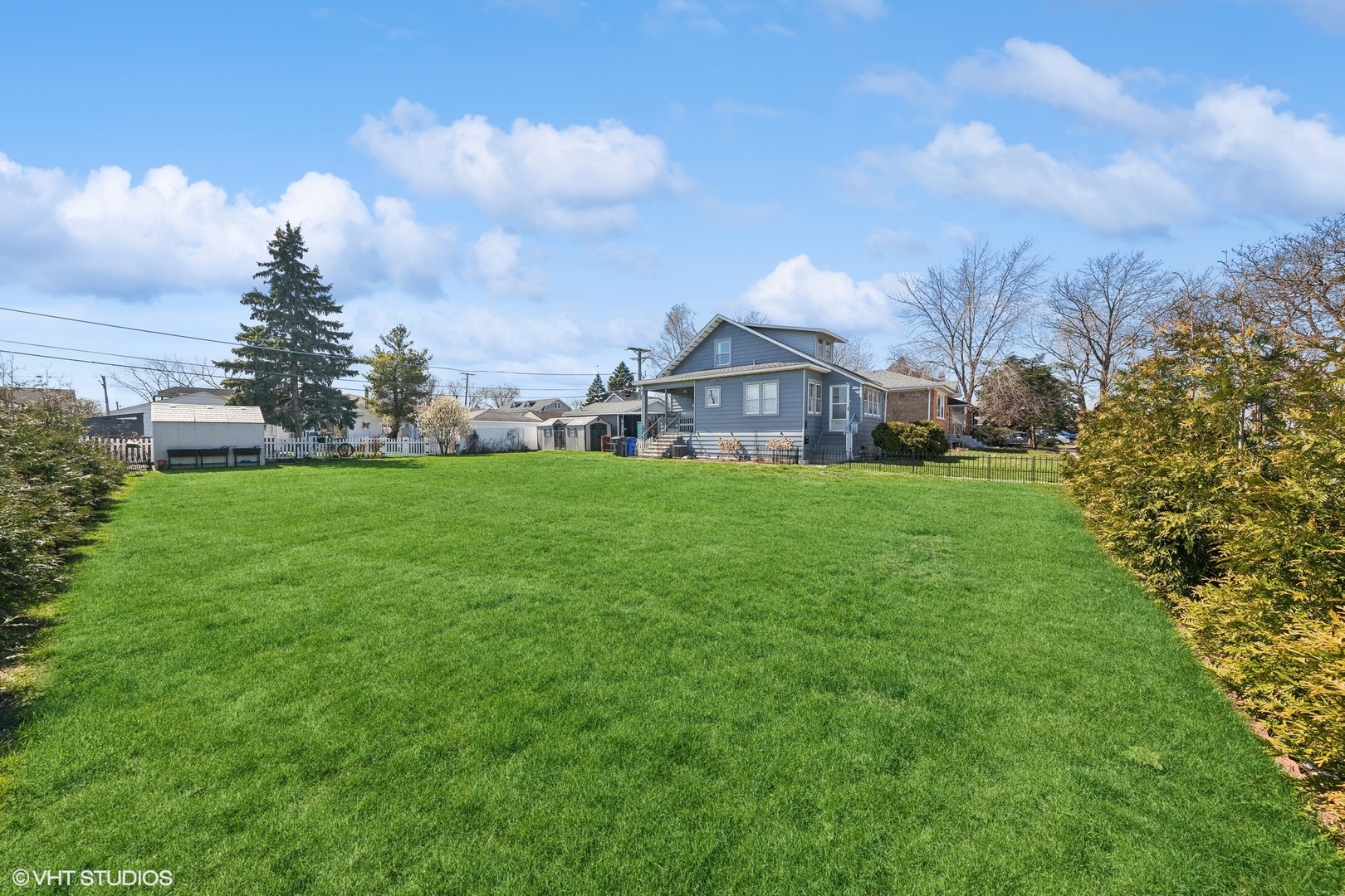 8715 44th Place Lyons, IL 60534 - Photo 23 of 28 a view of a house with a big yard and large trees