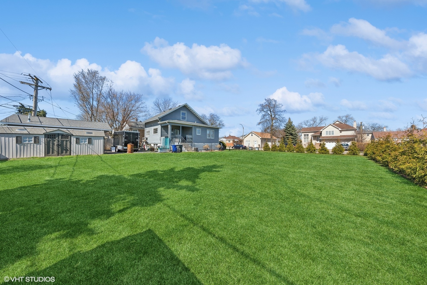 8715 44th Place Lyons, IL 60534 - Photo 24 of 28 a view of a house with a big yard and large trees