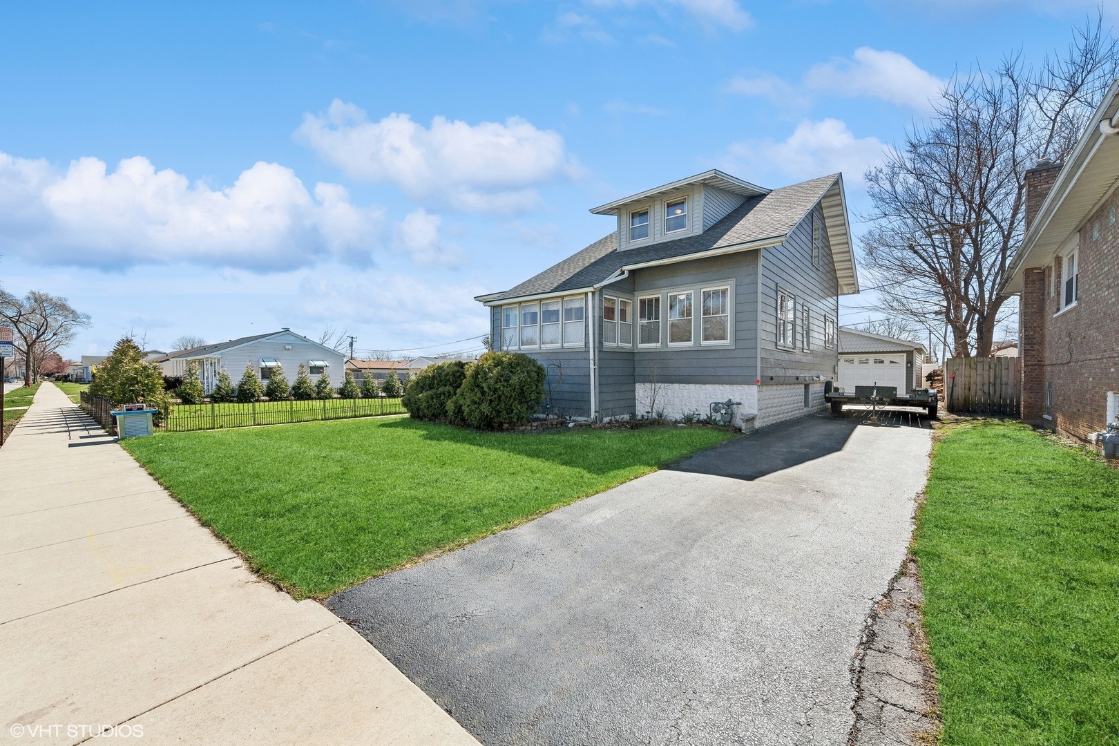 8715 44th Place Lyons, IL 60534 - Photo 3 of 28 a view of a house with a big yard plants and large trees