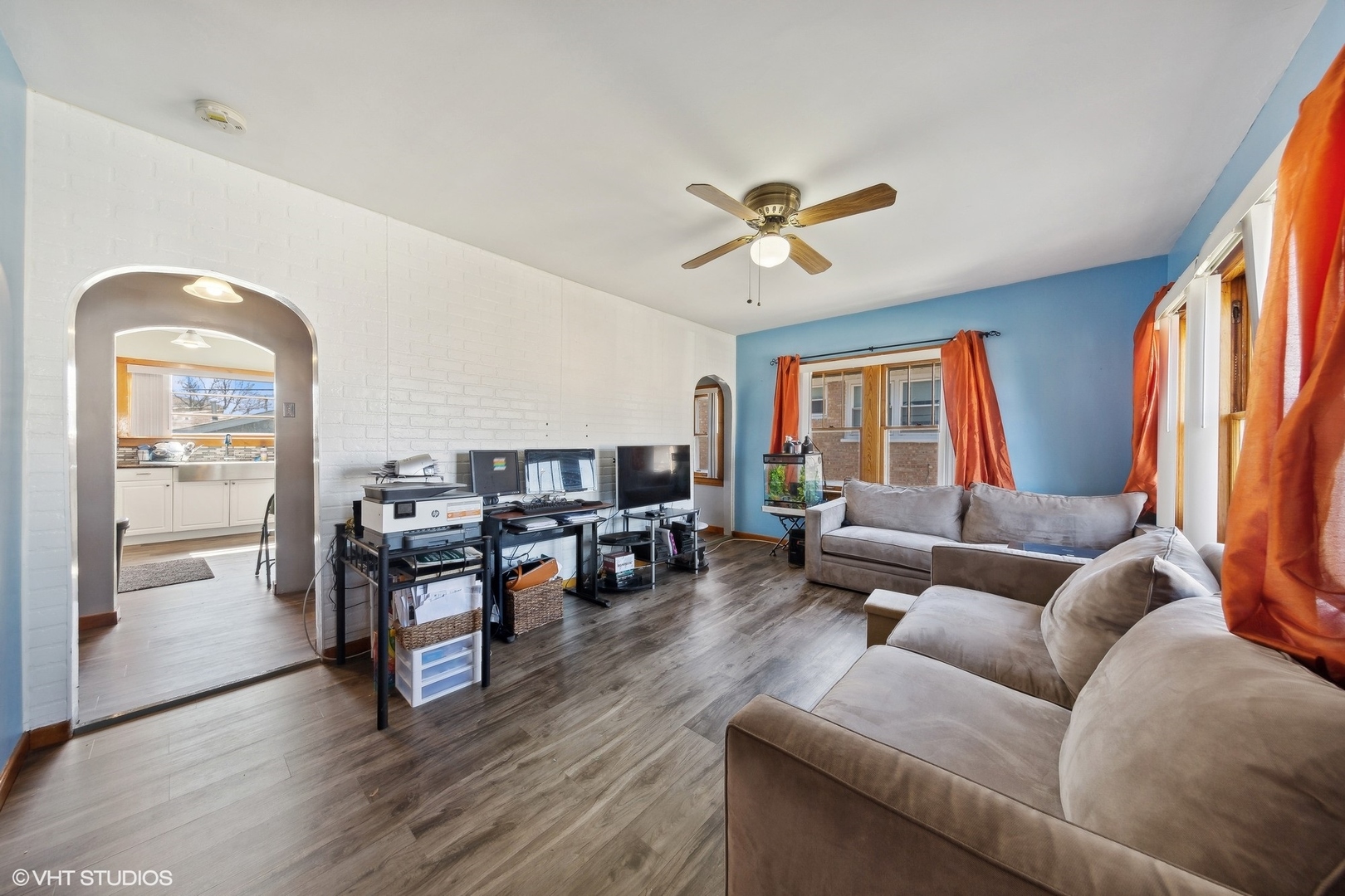 8715 44th Place Lyons, IL 60534 - Photo 8 of 28 a living room with furniture and a flat screen tv with wooden floor