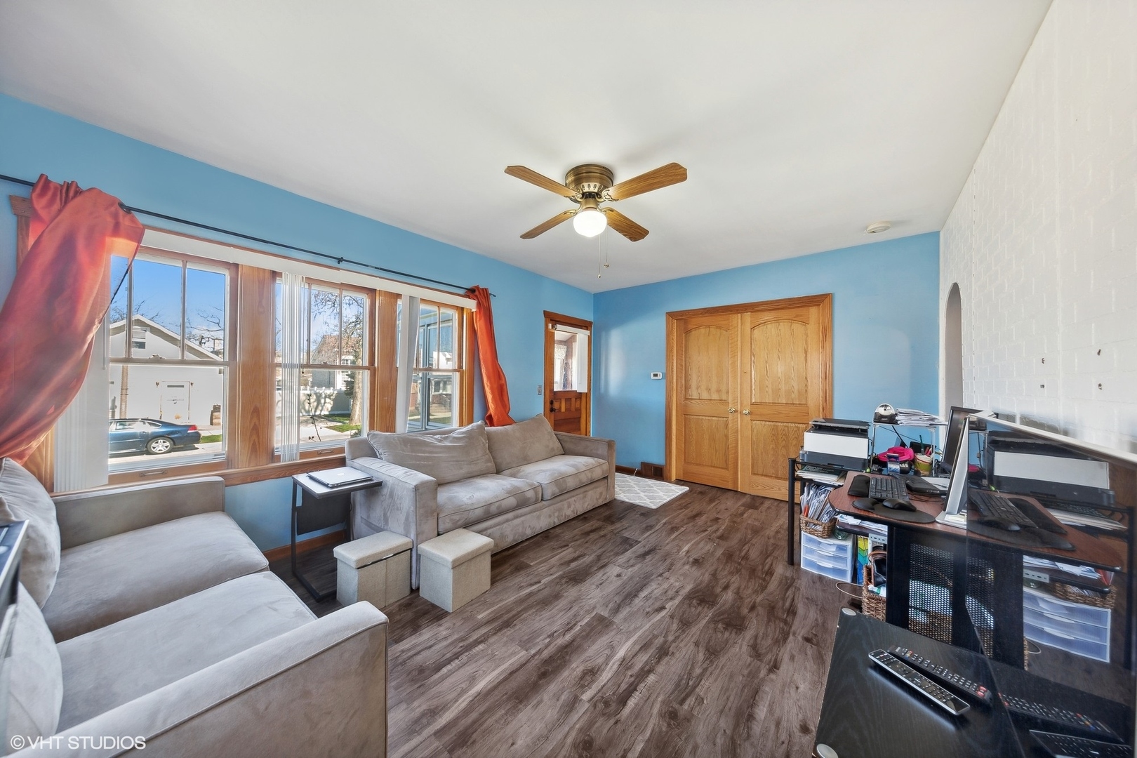 8715 44th Place Lyons, IL 60534 - Photo 10 of 28 a living room with furniture a fireplace and a large window