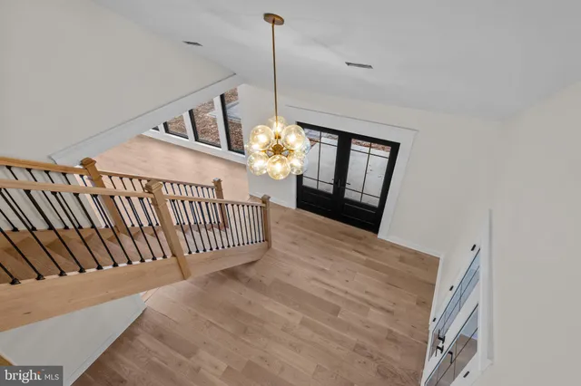 a view of a room with wooden floor