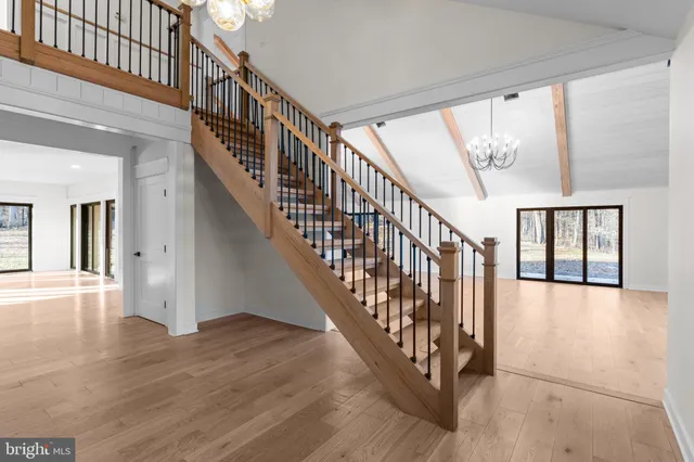 a view of an entryway wooden floor and door
