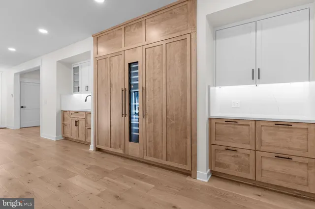 a view of a kitchen with white doors