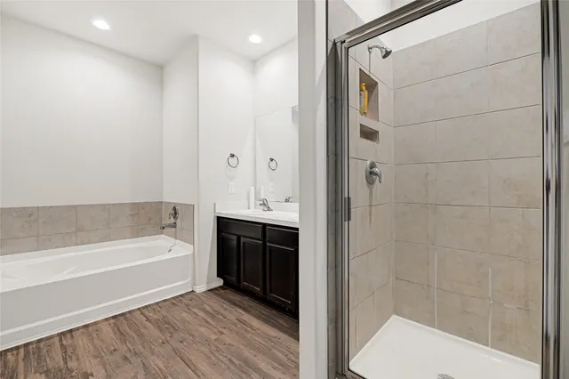a bathroom with a bathtub and a shower
