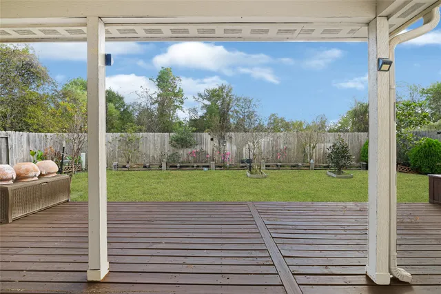 a view of a back yard from a balcony