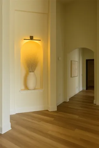 a view of a livingroom with furniture wooden floor and a rug